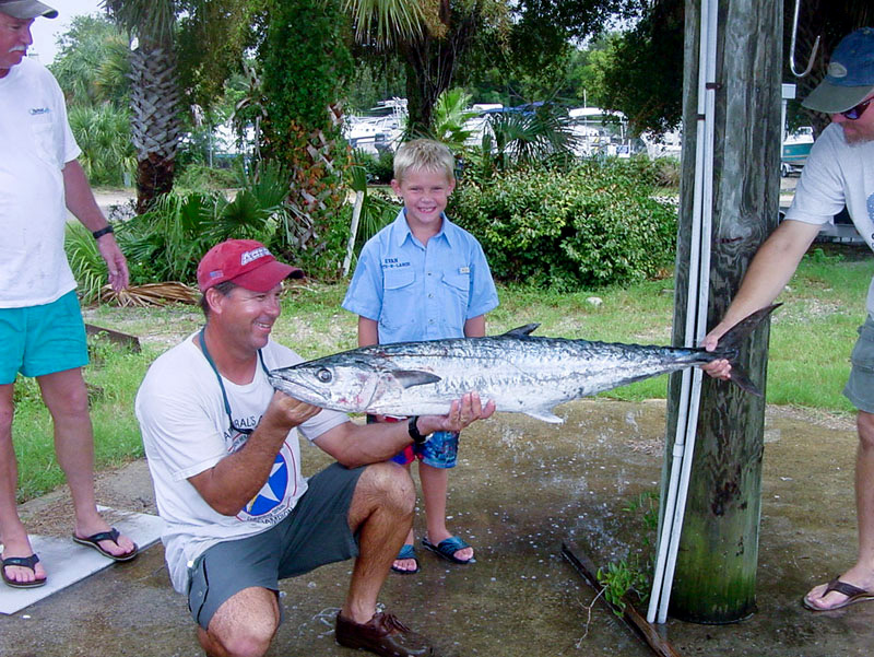 Chris Bernacki Helping a Junior Angler with his Kingfish